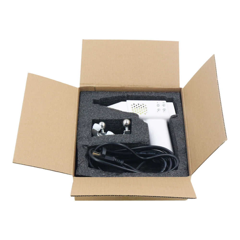 White hair dryer with black cord in an open cardboard box on a white background
