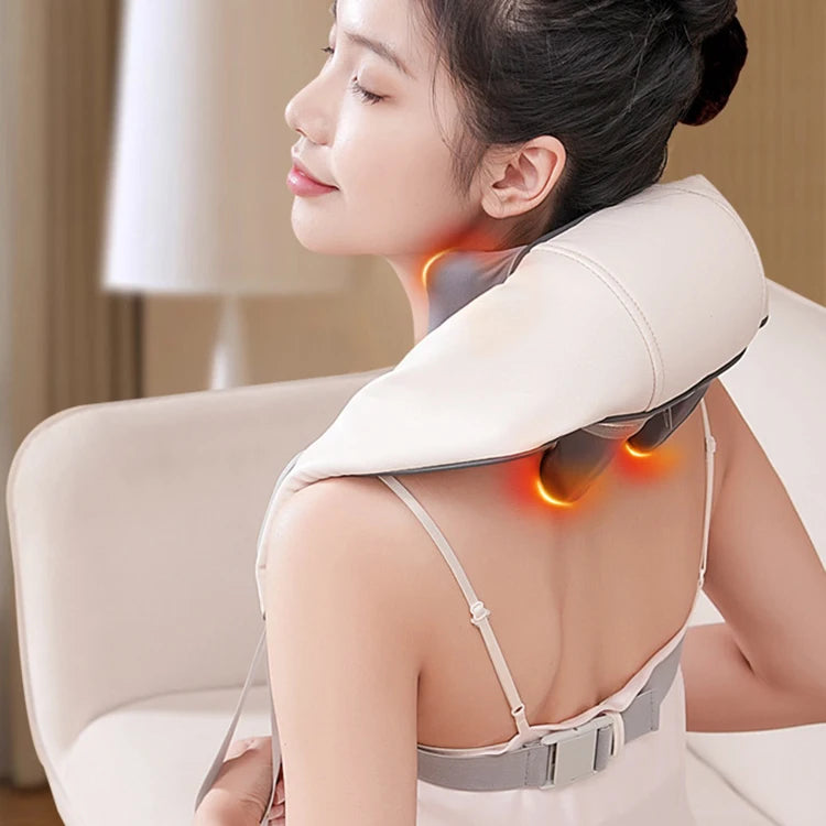 Woman using a neck and shoulder massager in a home setting,آلة التدليك