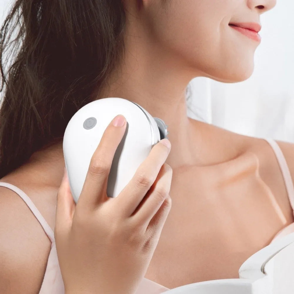 Woman using a white electronic device on her neck against a plain background